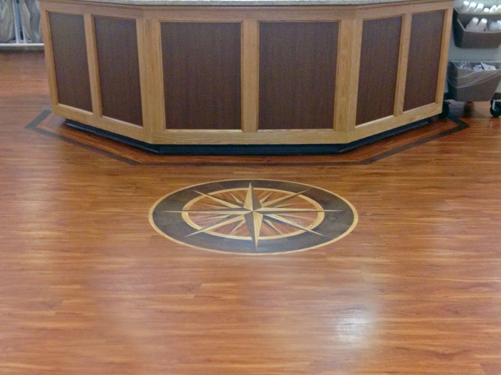 Custom Compass Rose medallion with borders in front of a nurses' station.
