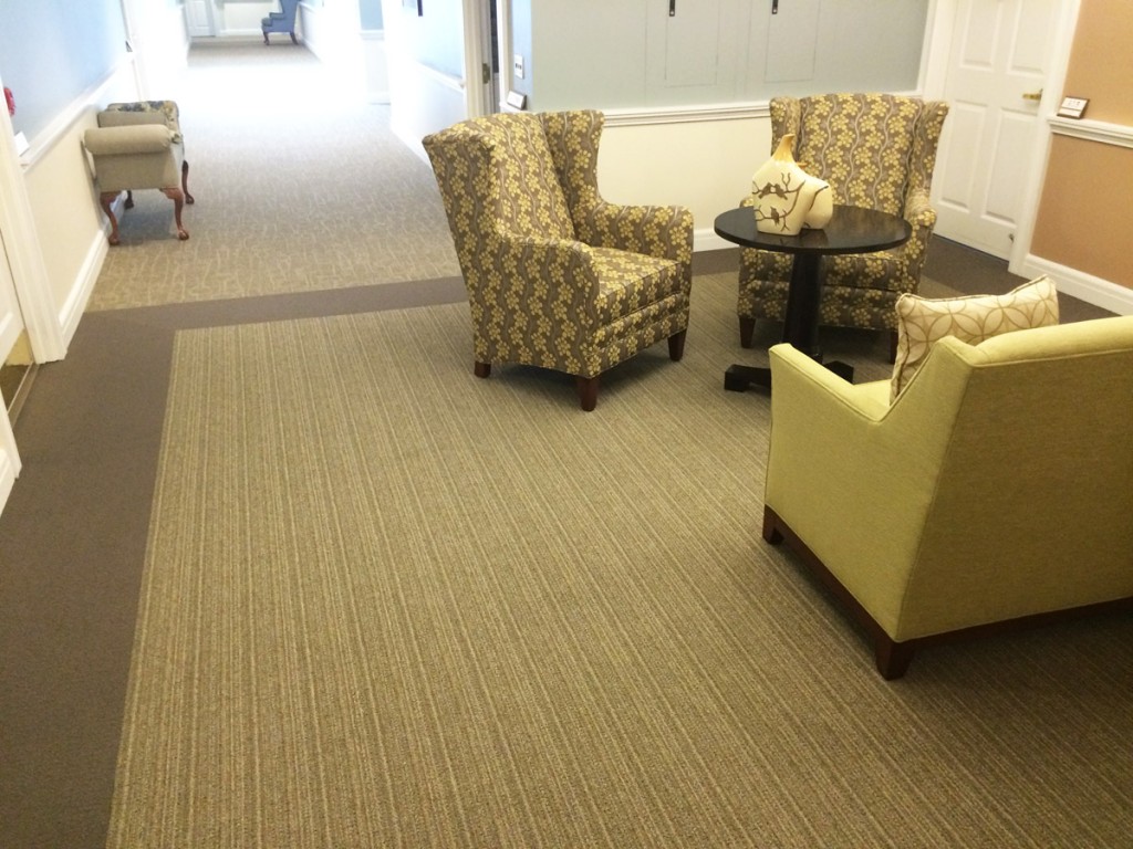 Patterned Broadloom inset with border in Sitting Area.