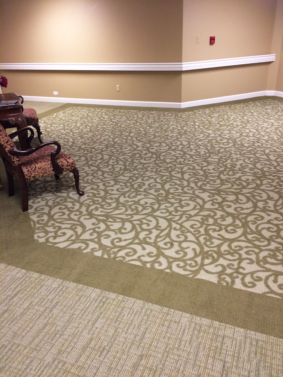 Patterned Broadloom inset with border in Hallway.