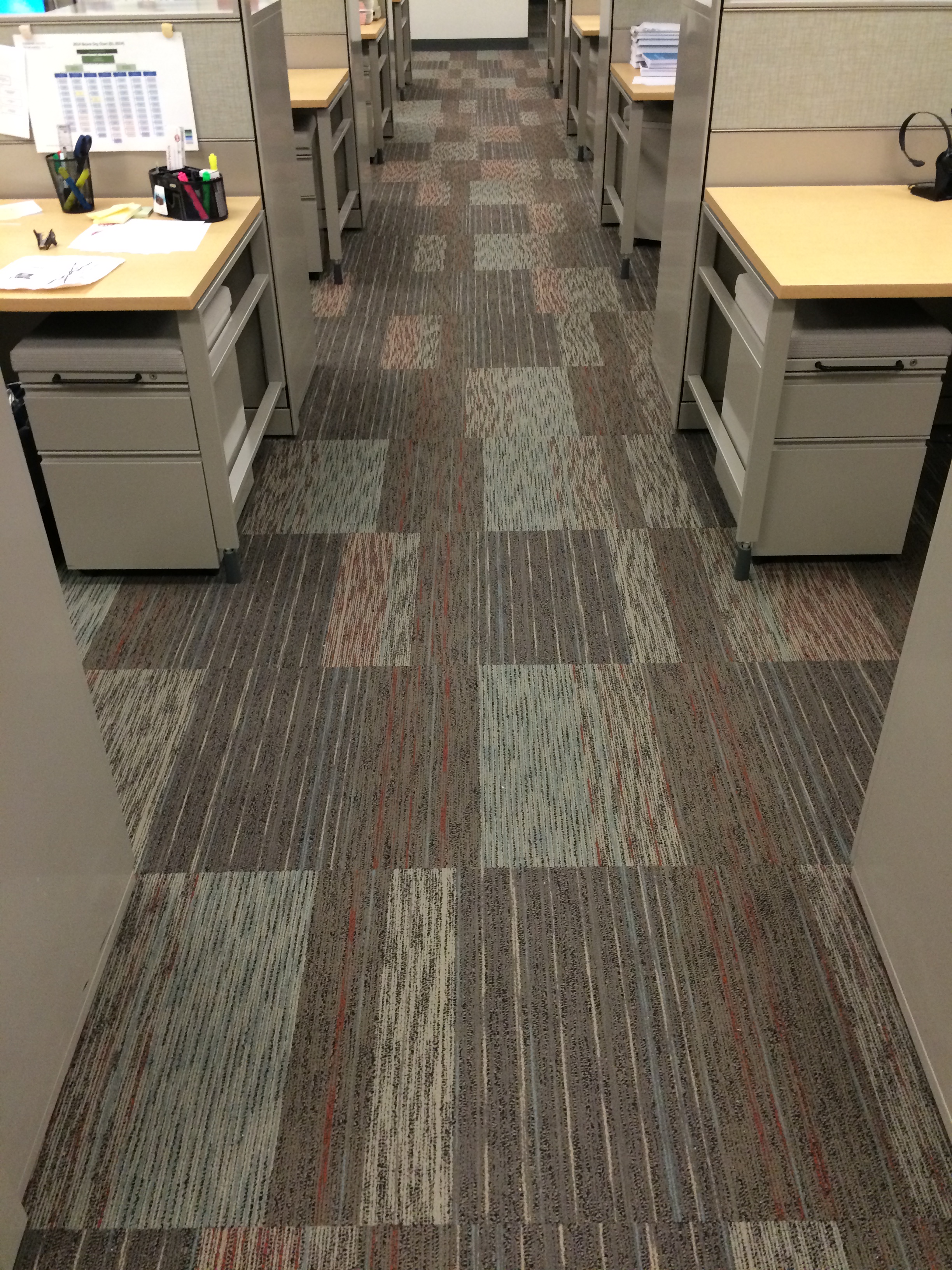 Carpet tiles in a brickwork pattern in an office building