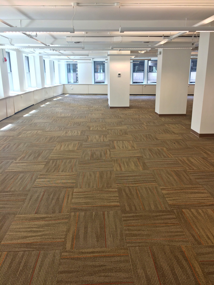Carpet tiles, quarter turned in an open office.